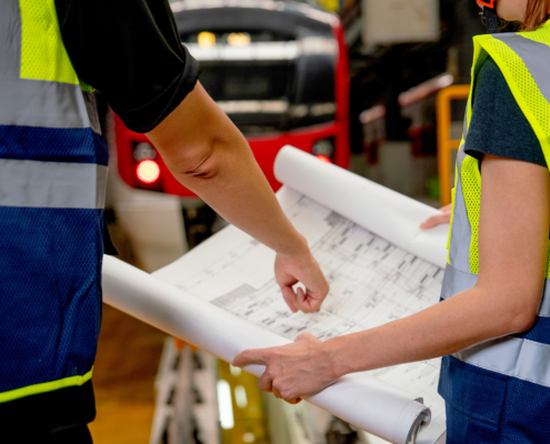 Close up hands of engineer or technician worker point to drawing paper